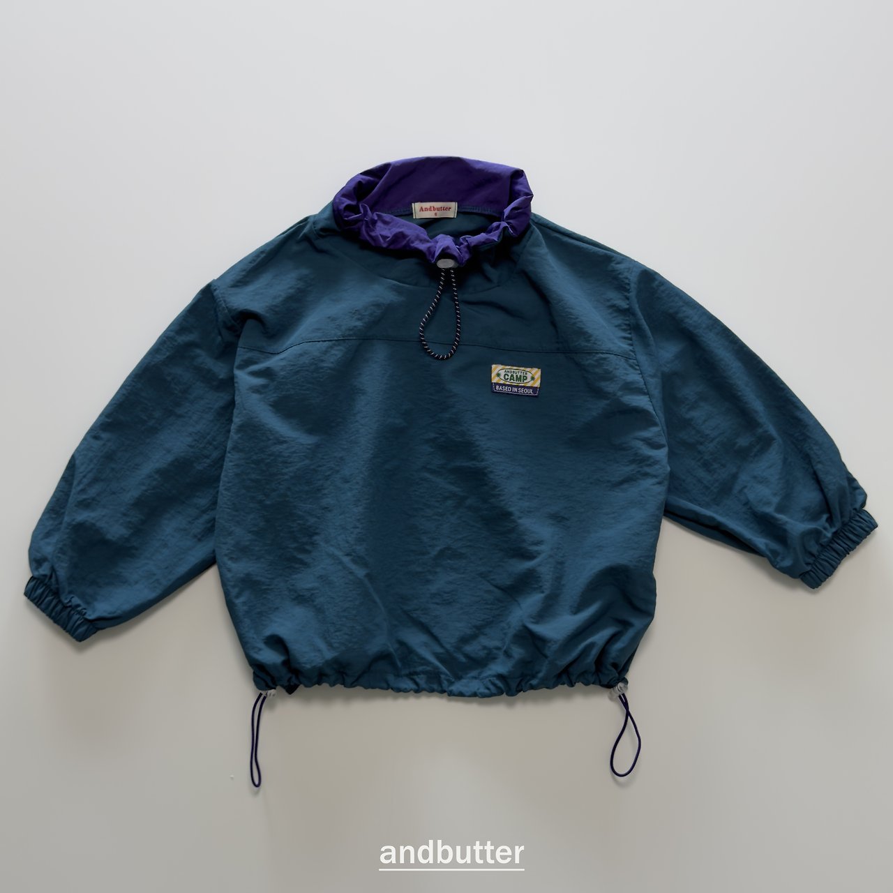 《予約》Color Neck Anorak / ANDBUTTER
