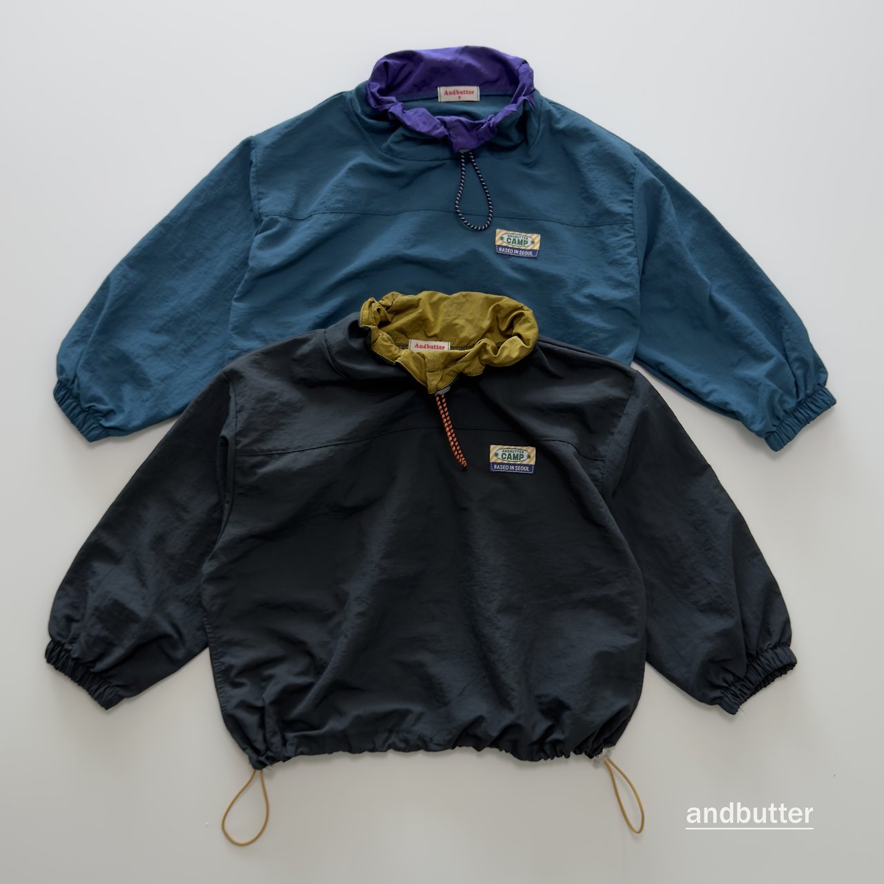 《予約》Color Neck Anorak / ANDBUTTER