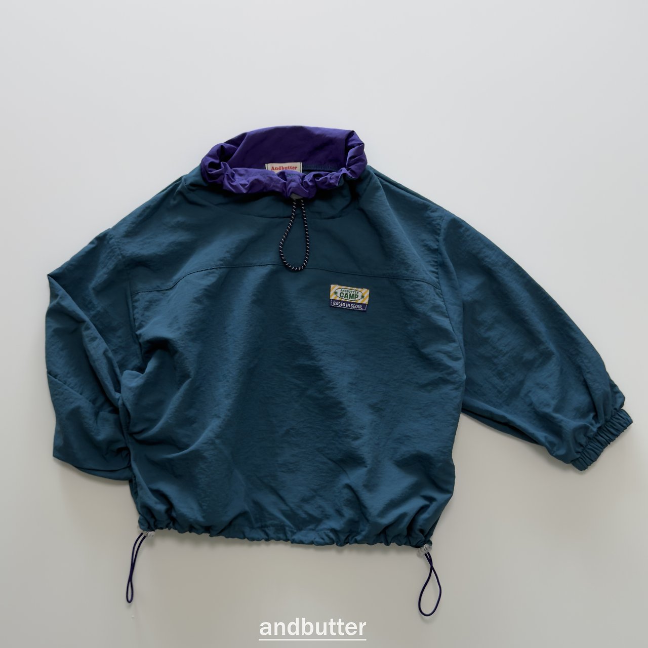 《予約》Color Neck Anorak / ANDBUTTER
