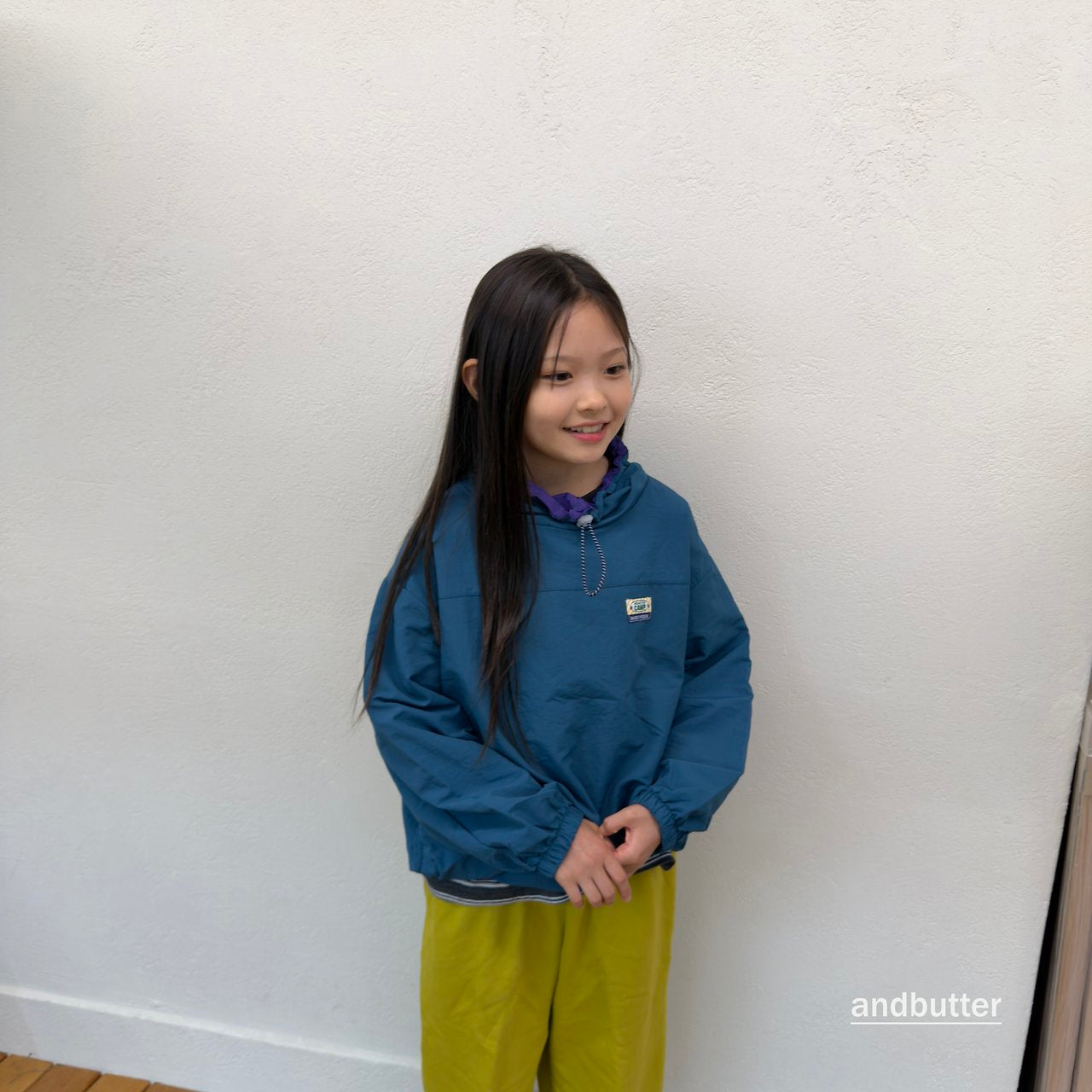 《予約》Color Neck Anorak / ANDBUTTER
